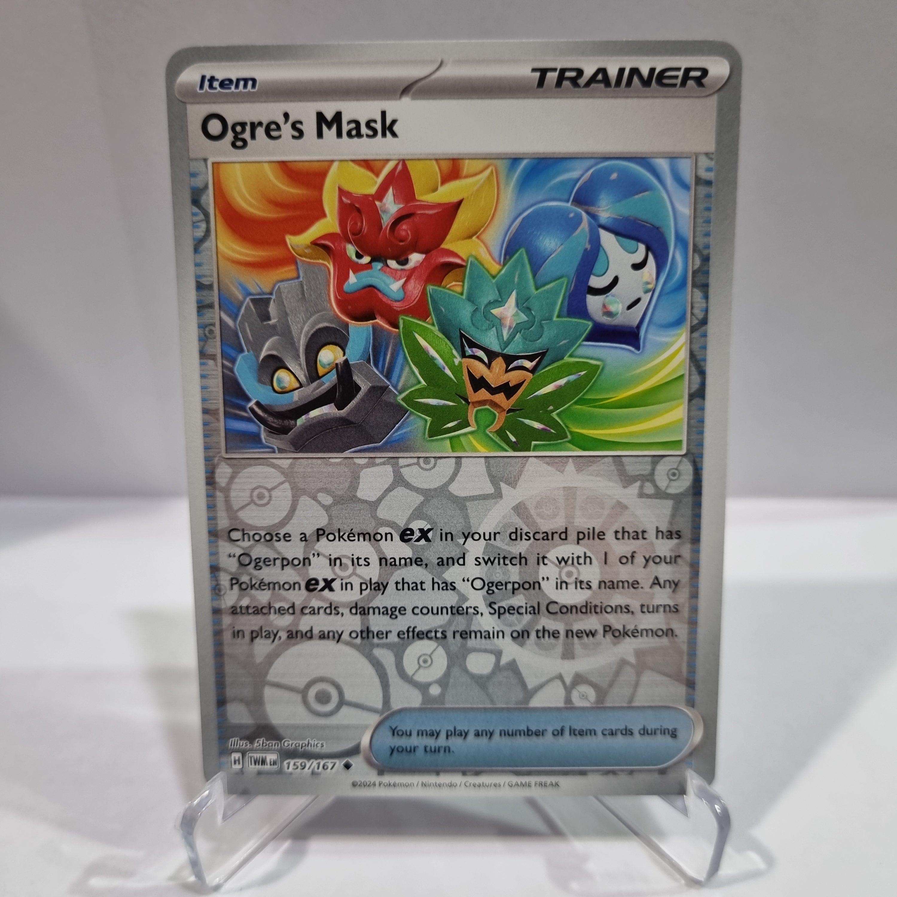 Pokemon TCG Scarlet & Violet expansion Twilight Masquerades. Ogre's Mask Reverse Holo card.