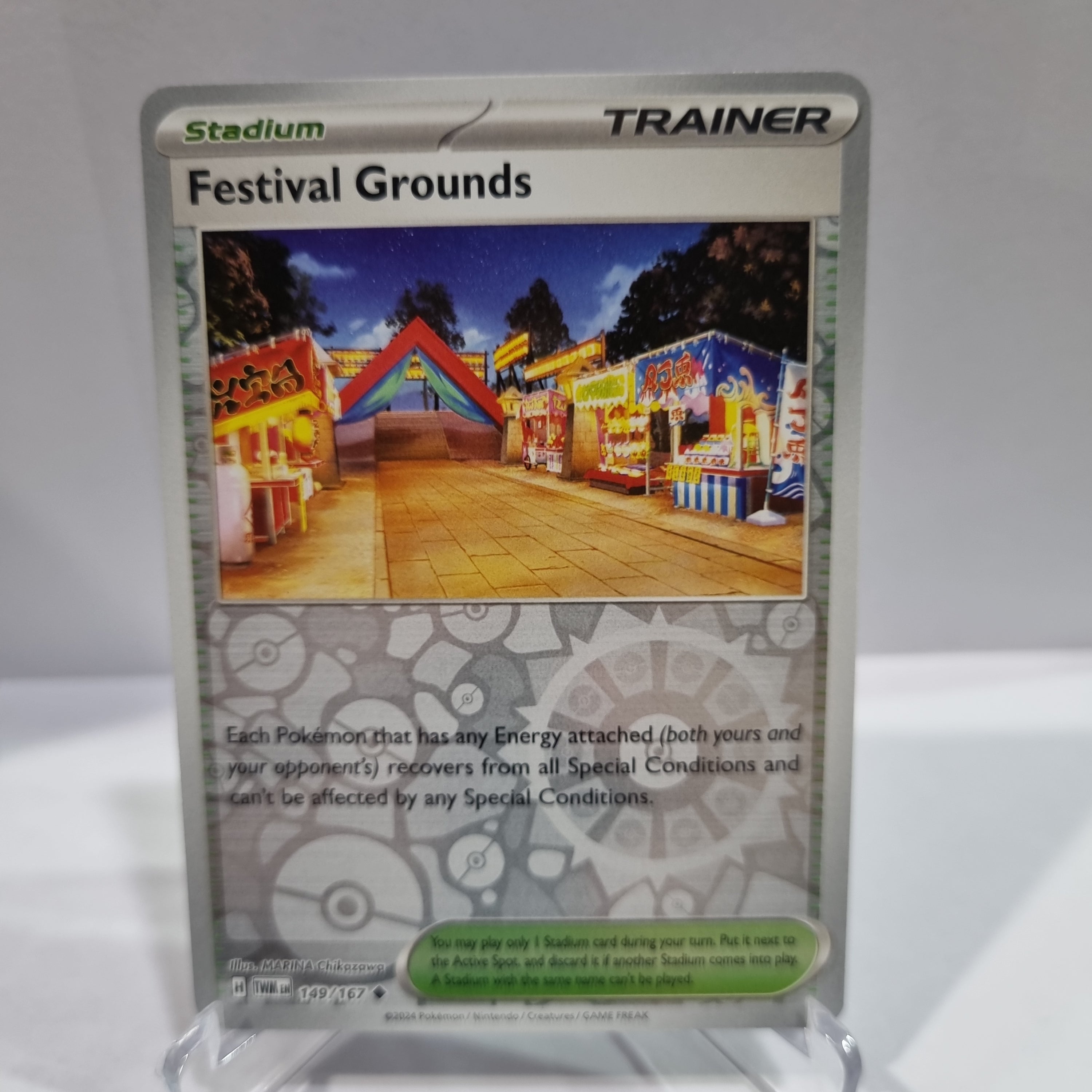 Pokemon TCG Scarlet & Violet expansion Twilight Masquerades. Festival Grounds Reverse Holo card.