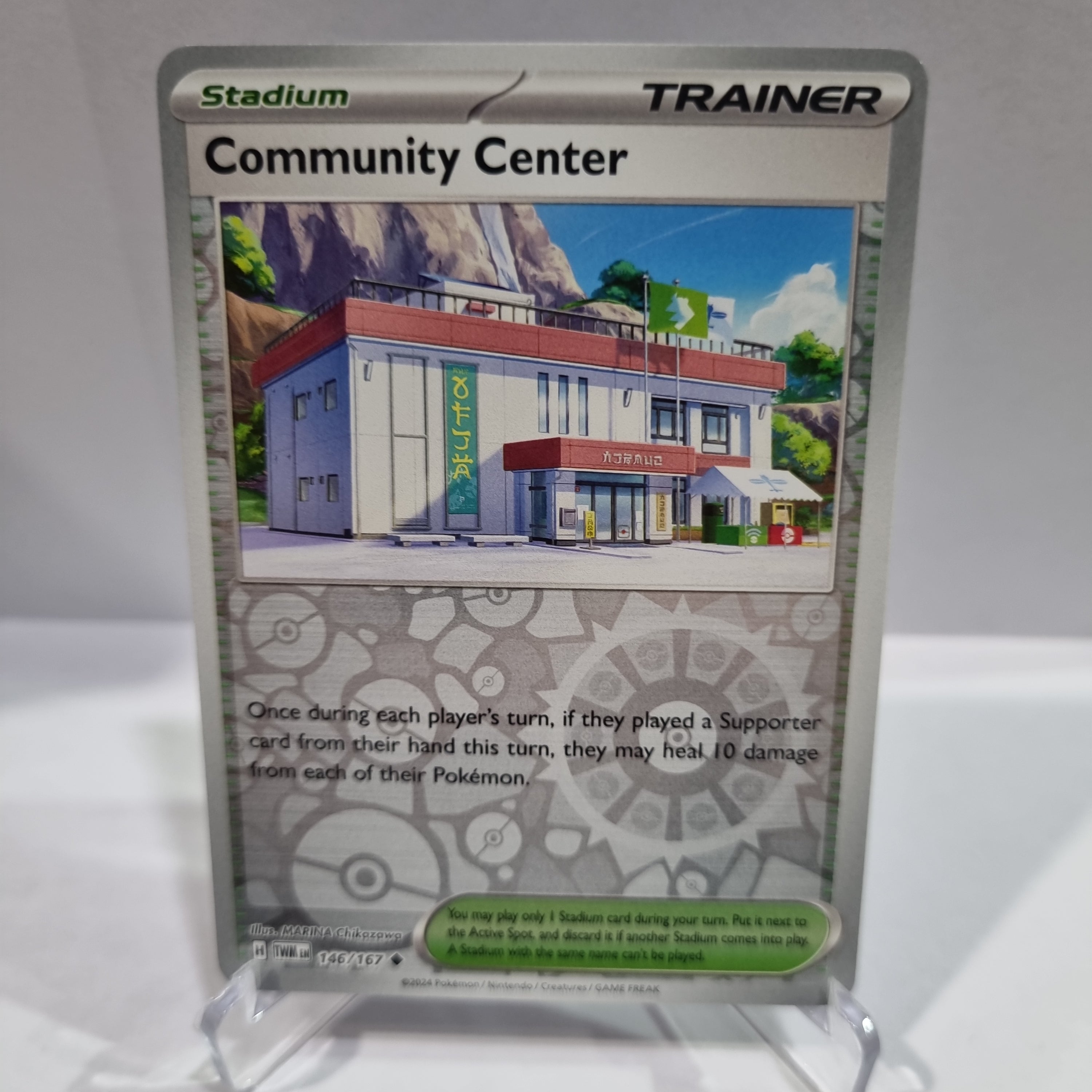 Pokemon TCG Scarlet & Violet expansion Twilight Masquerades. Community Center Reverse Holo card.