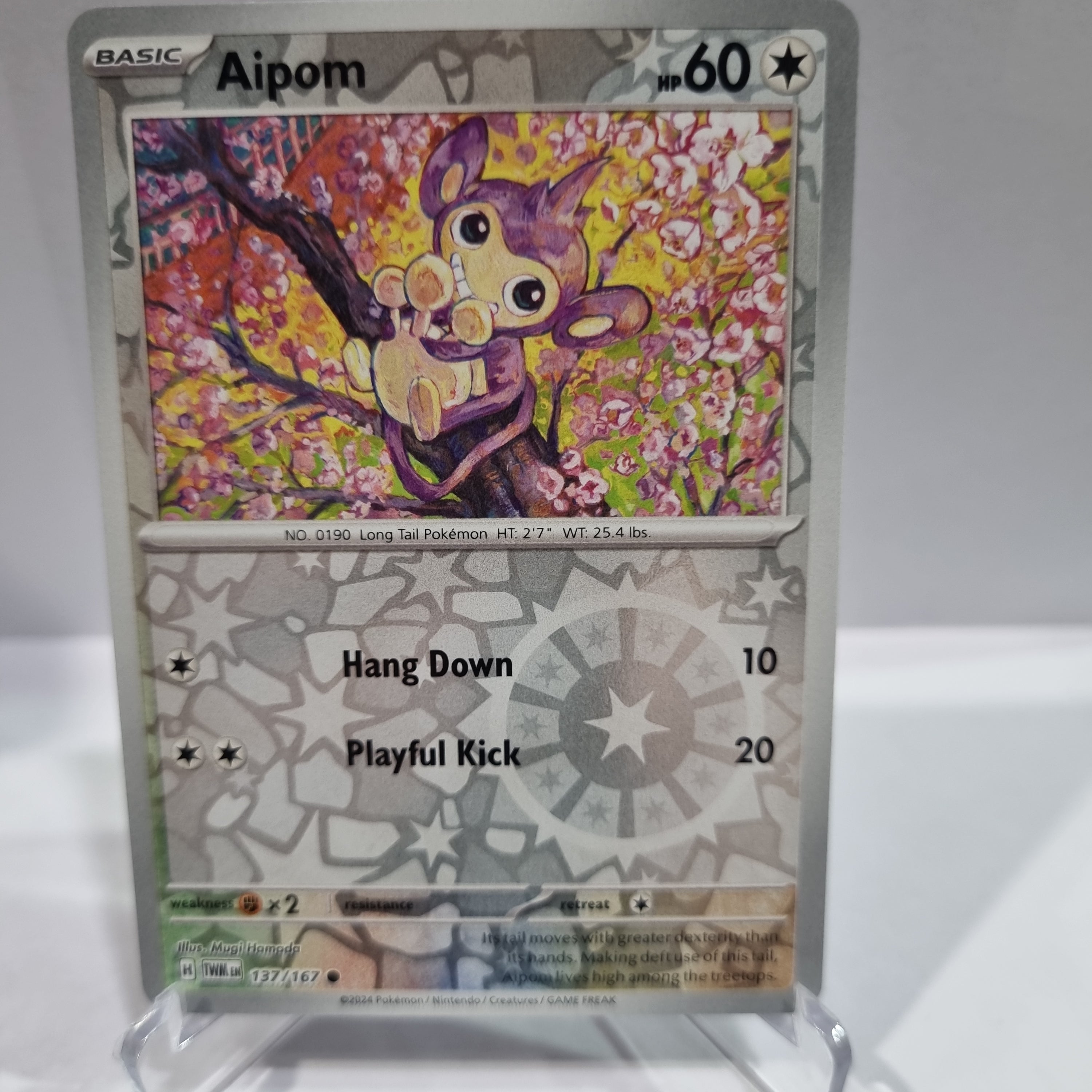 Pokemon TCG Scarlet & Violet expansion Twilight Masquerades. Aipom Reverse Holo card.