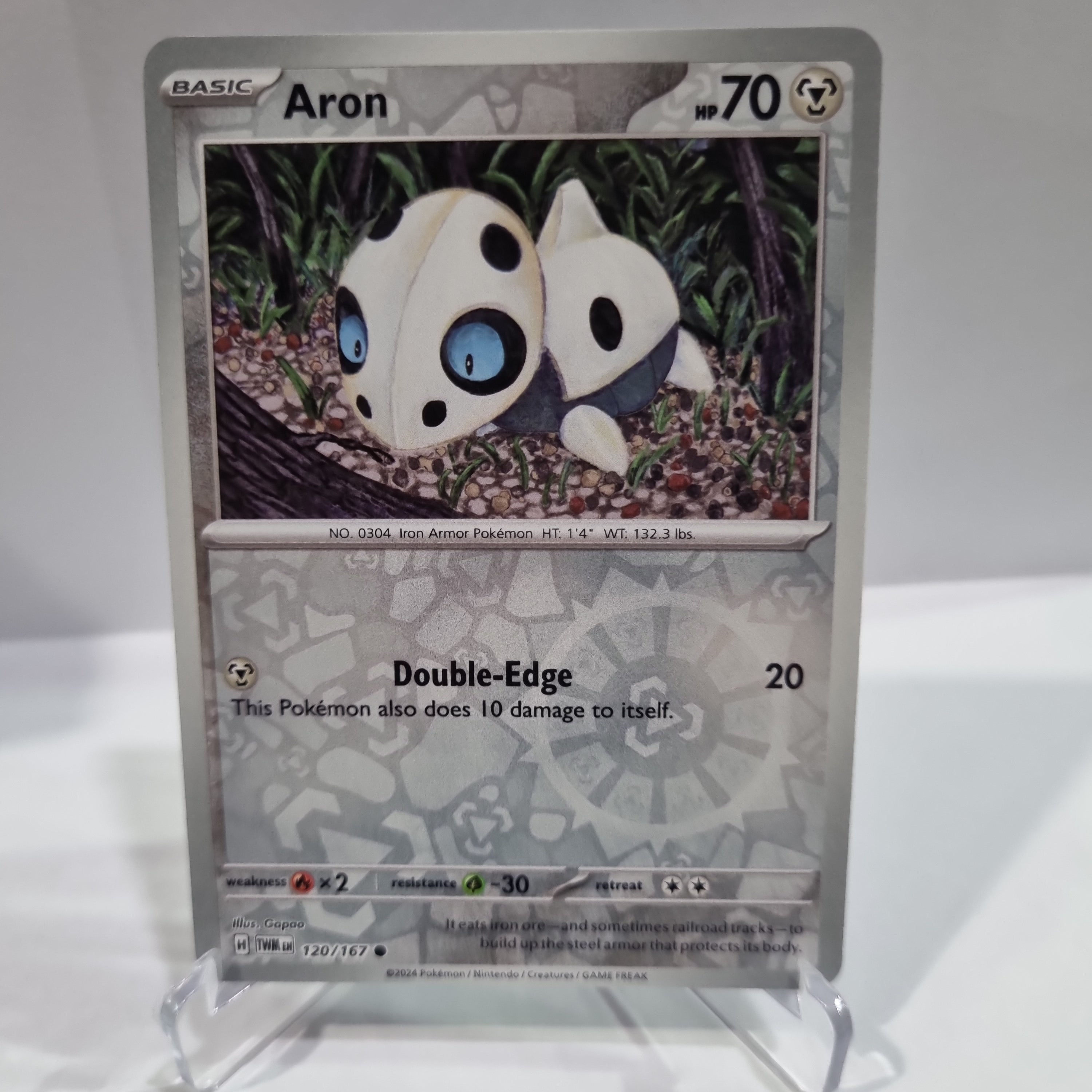 Pokemon TCG Scarlet & Violet expansion Twilight Masquerades. Aron Reverse Holo card.
