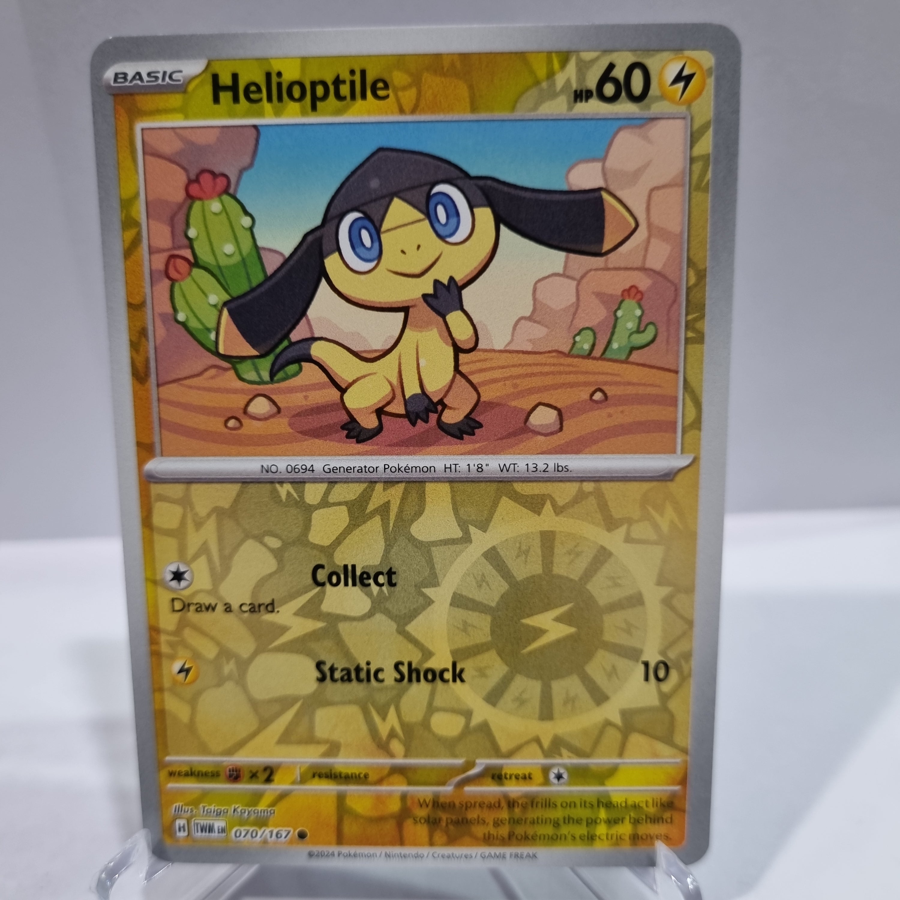 Pokemon TCG Scarlet & Violet expansion Twilight Masquerades. Helioptile Reverse Holo card.