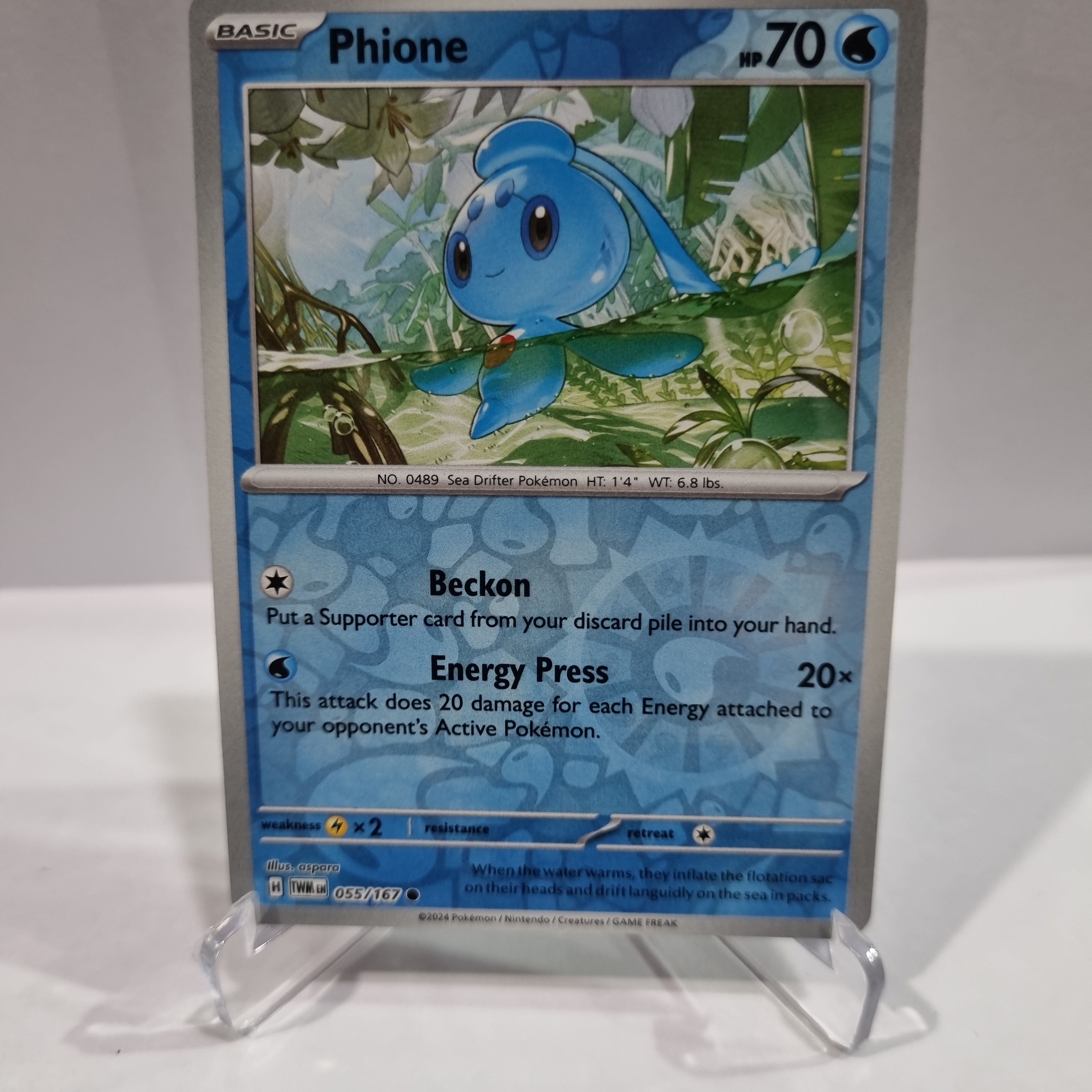Pokemon TCG Scarlet & Violet expansion Twilight Masquerades. Phione Reverse Holo card.