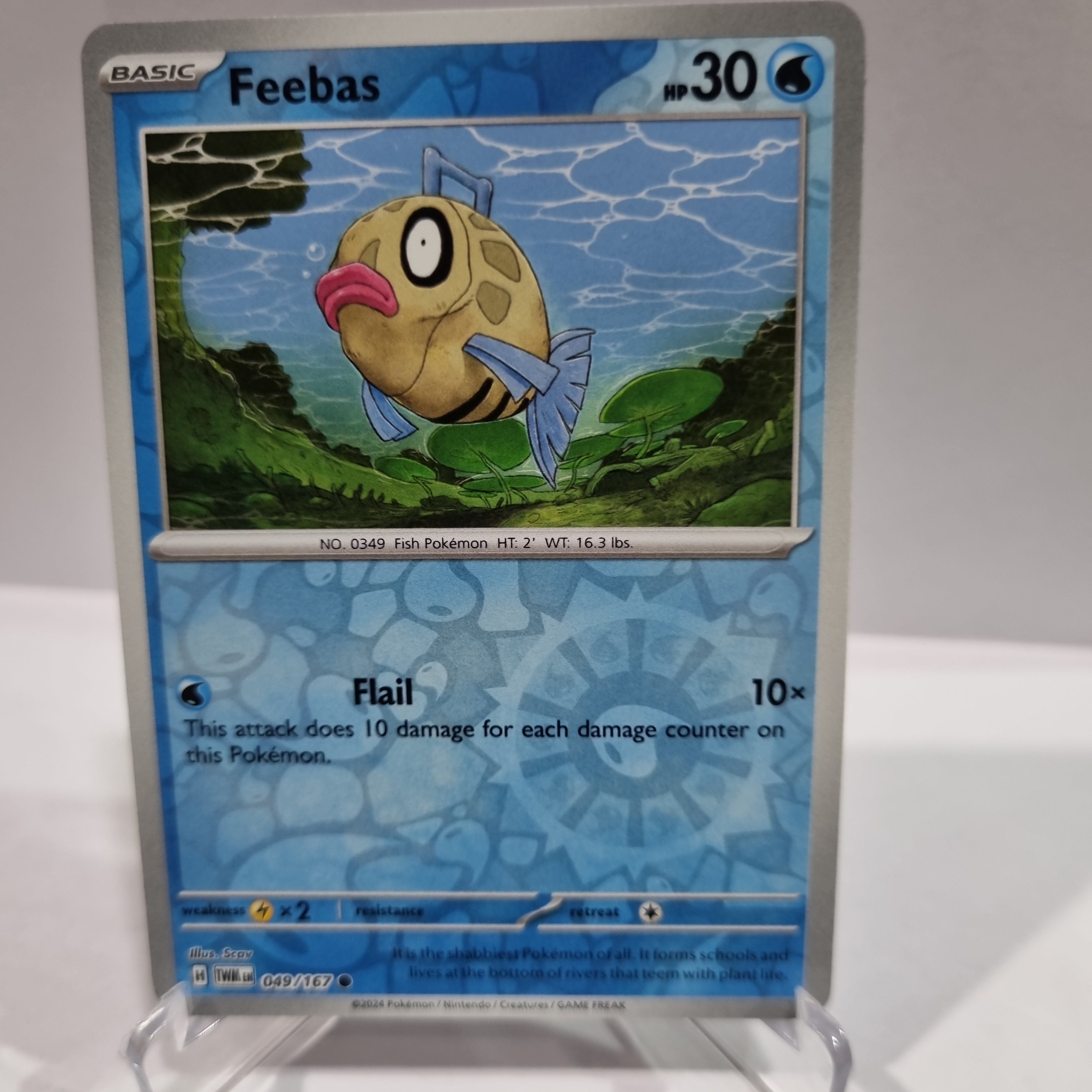 Pokemon TCG Scarlet & Violet expansion Twilight Masquerades. Feebas Reverse Holo card.