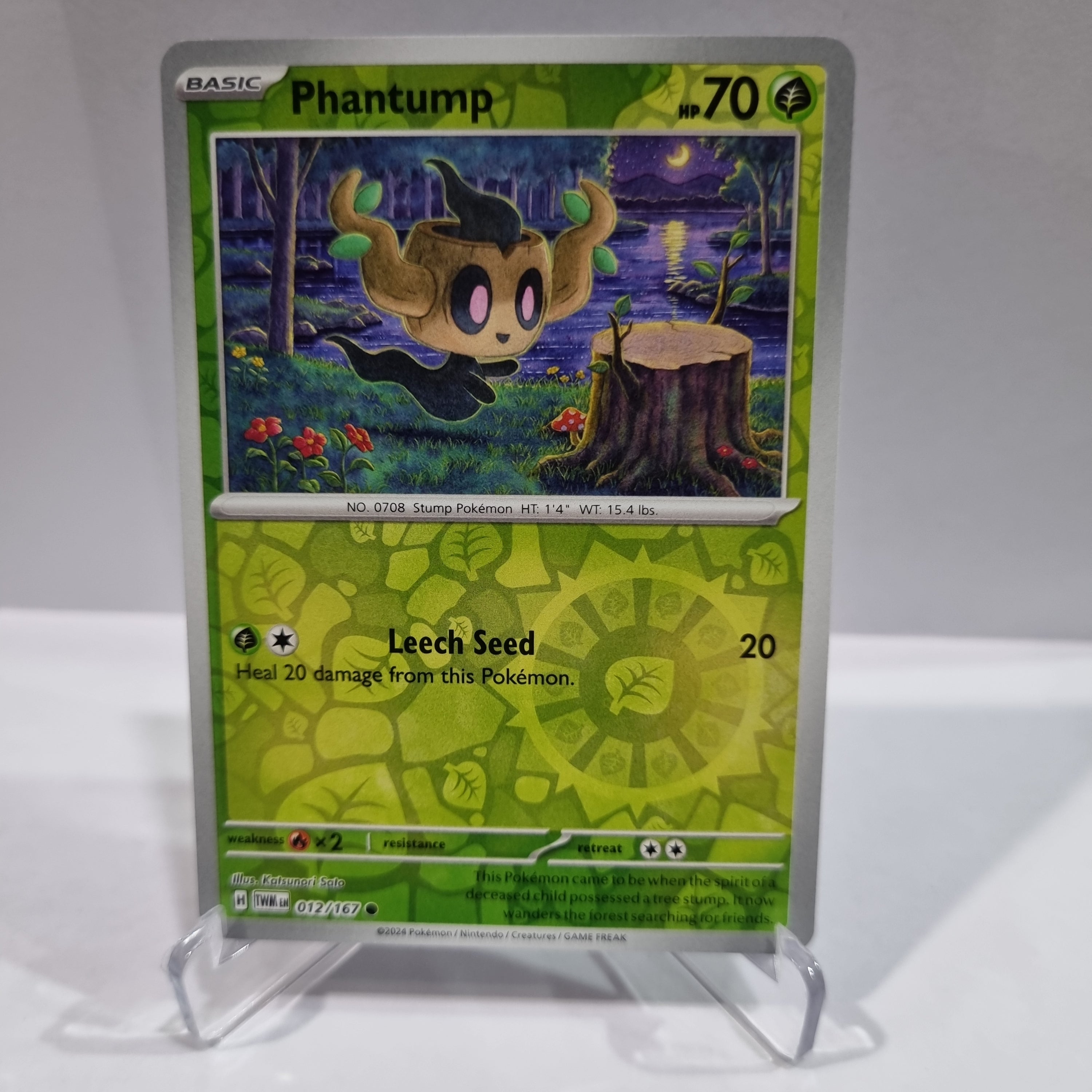 Pokemon TCG Scarlet & Violet expansion Twilight Masquerades. Phantump Reverse Holo card.