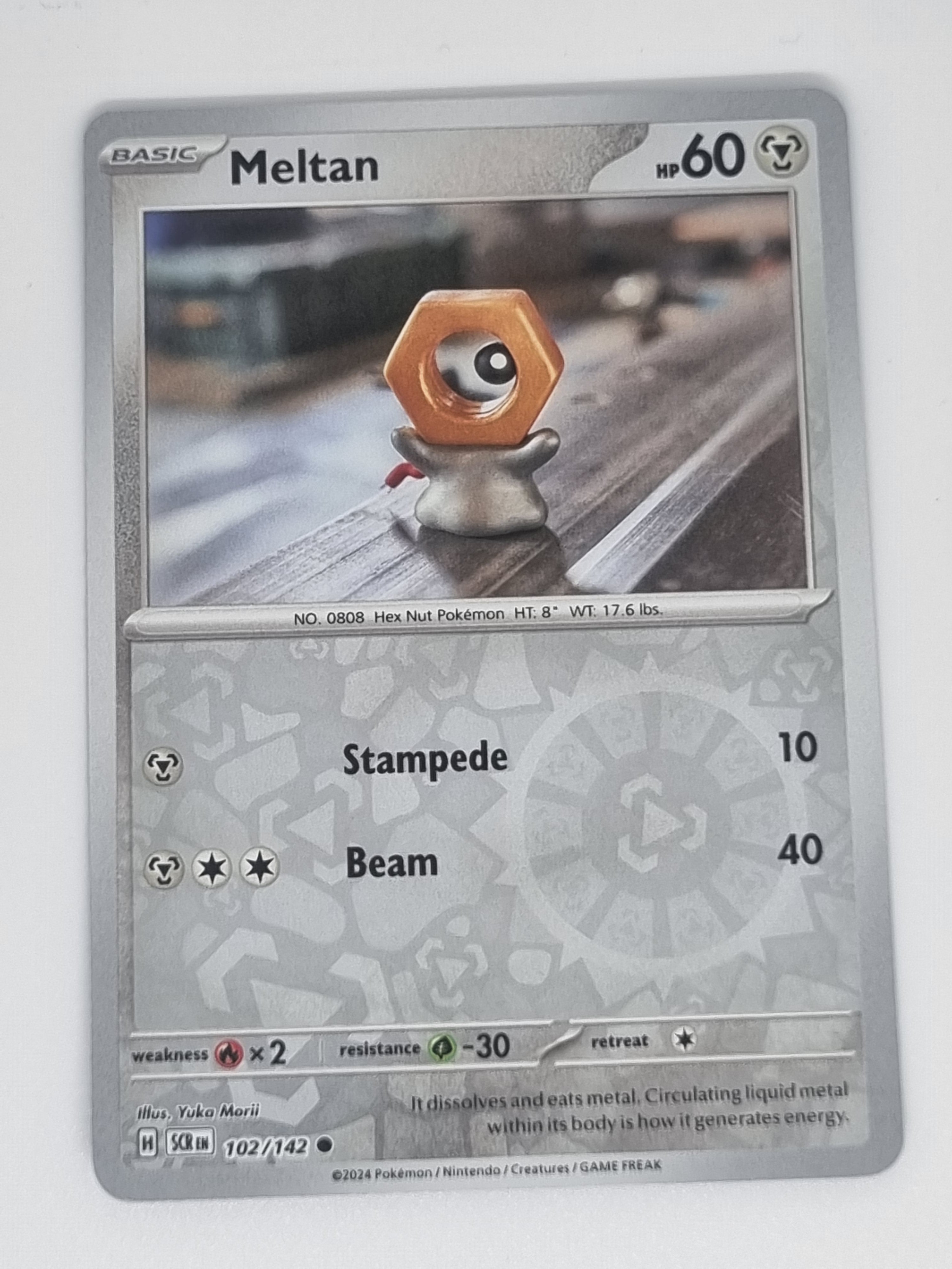 Pokemon TCG - Stellar Crown - #102/142 - Meltan - Common - Reverse Holo
