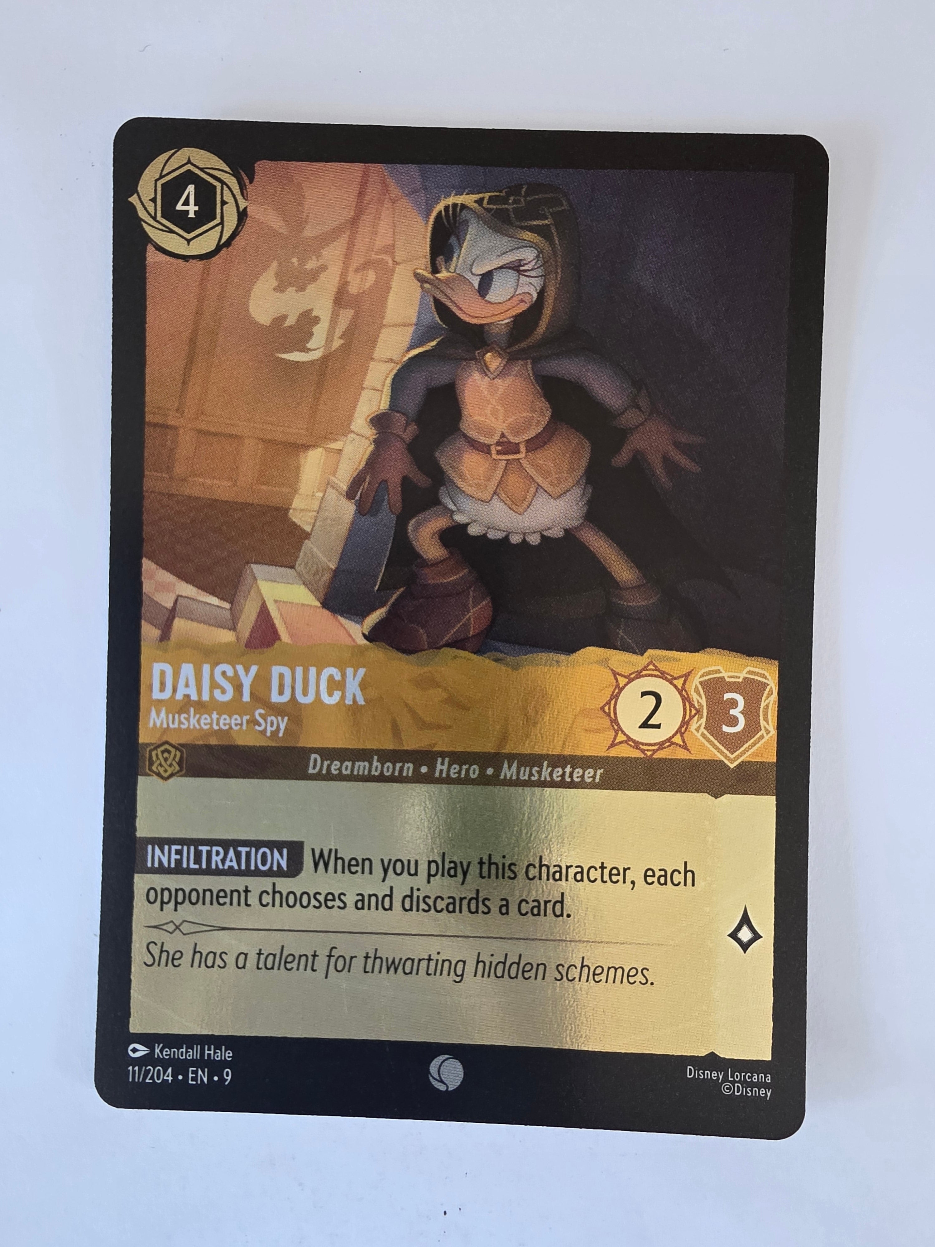 Disney Lorcana | Fabled | 11/204 |COLDFOIL | Daisy Duck - Musketeer Spy | Common