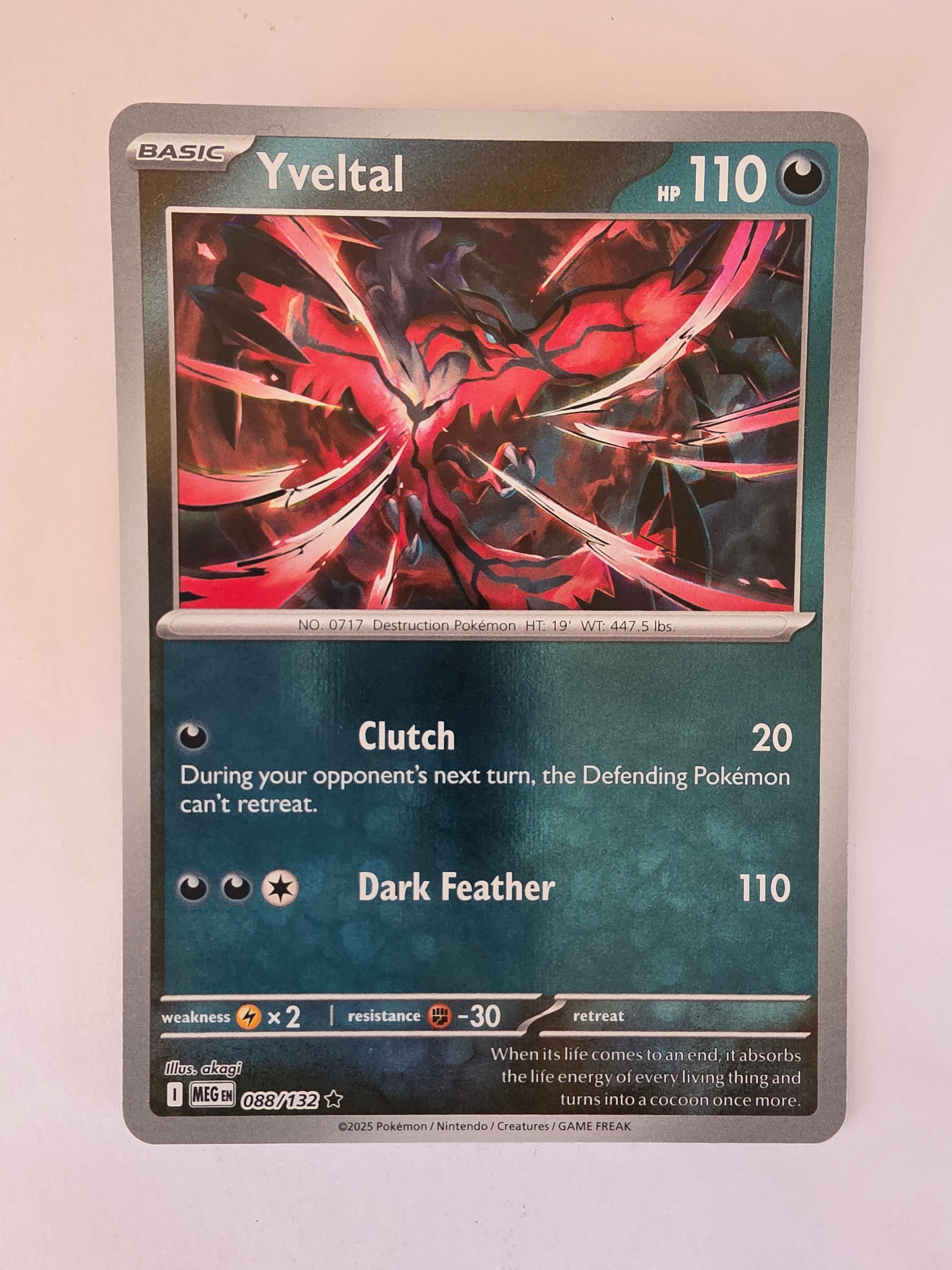 Pokémon trading card with red and black artwork on a white background