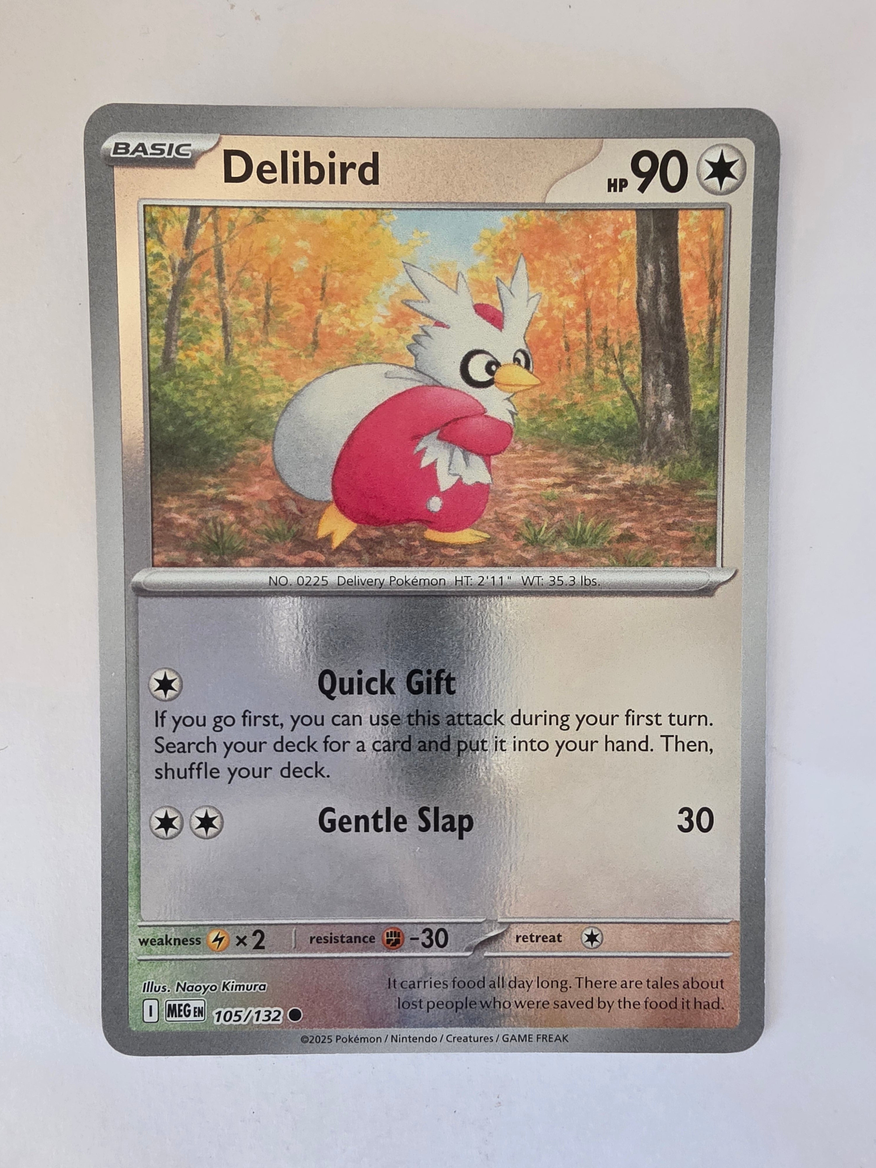 Pokémon trading card featuring Delibird with a forest background
