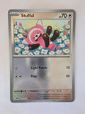 Card with a cartoon character and floral design on a white background