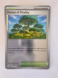 Pokémon trading card featuring a forest scene on a white background