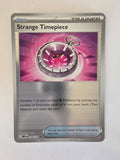 Trading card featuring a pocket watch design on a metallic background