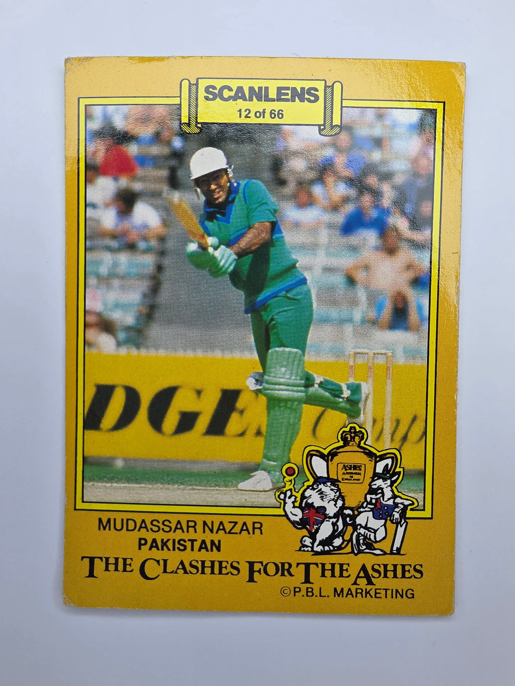 1986 Scanlens Clashes for the Ashes cricket trading card featuring Mudassar Nazar batting for Pakistan.