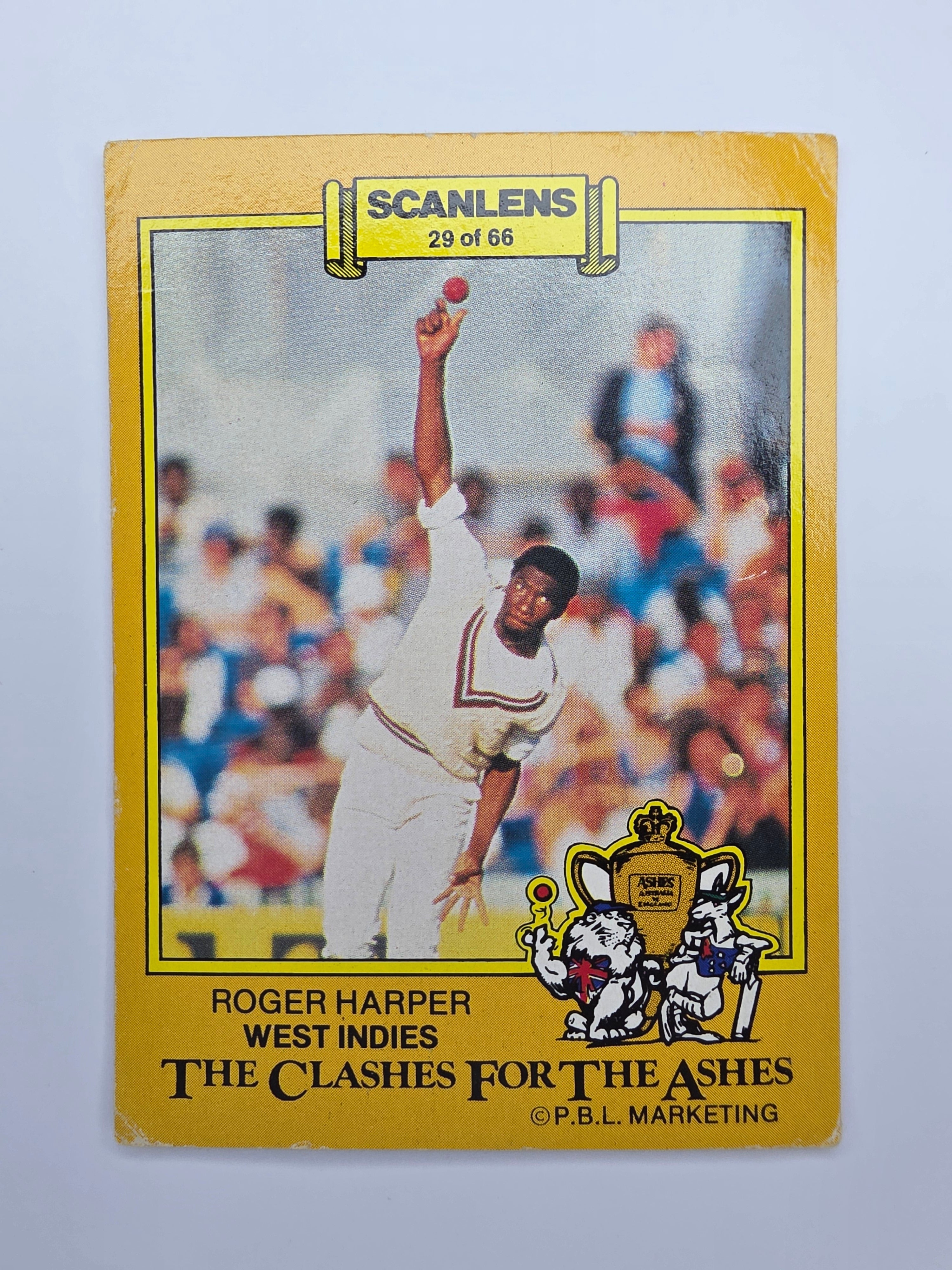 Scanlens 1986 cricket trading card from the Clashes for the Ashes featuring Roger Harper bowling for the West Indies.