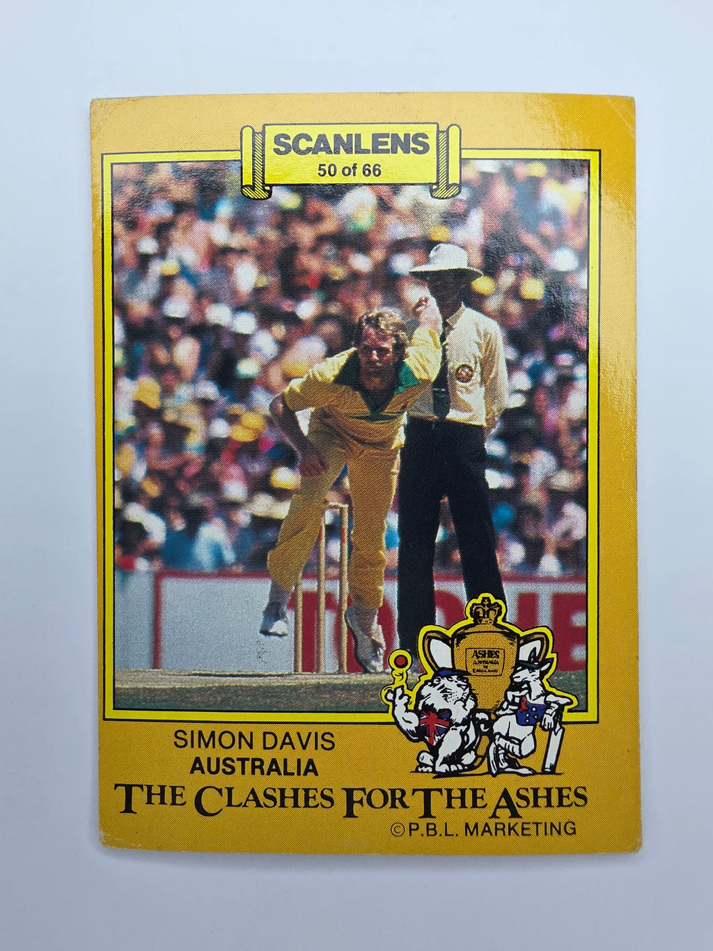 1986 Scanlens The Clashes for the Ashes cricket trading card featuring Simon Davis bowling for Australia.