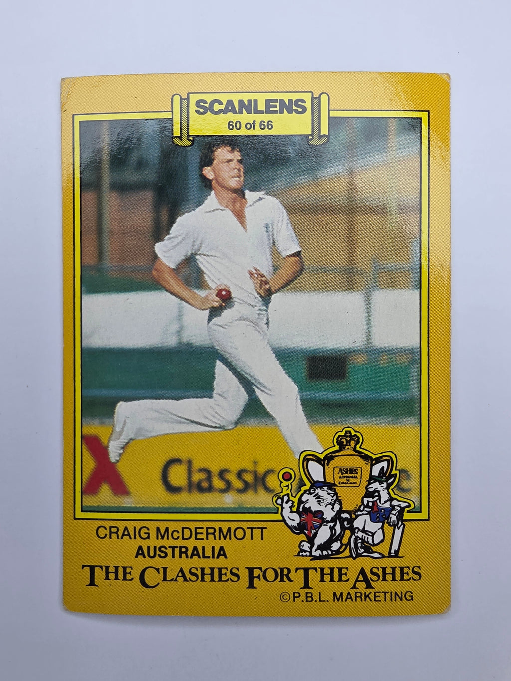 Scanlens 1986 The Clashes for the Ashes trading card of Craig McDermott bowling for Australia.