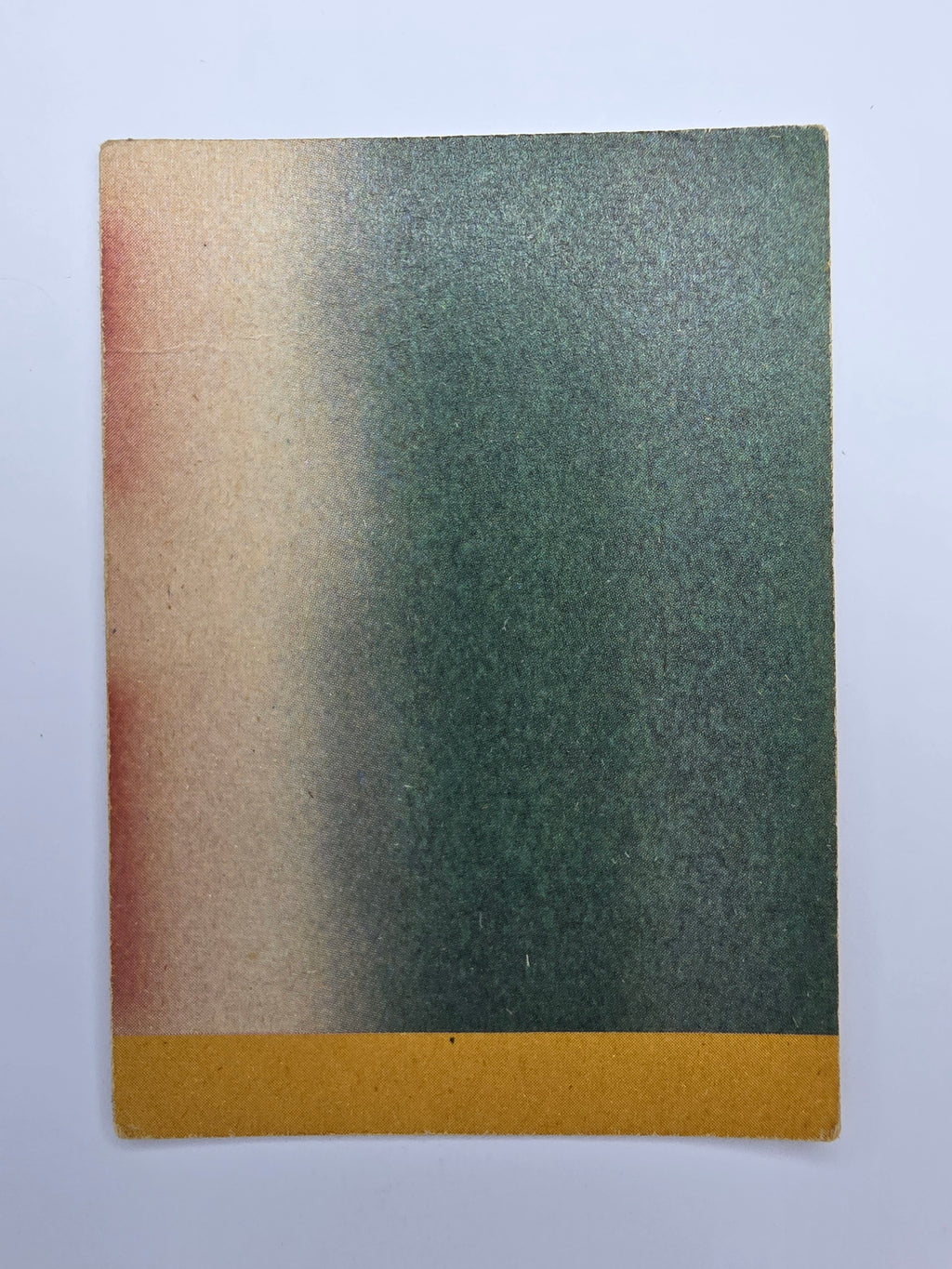 Rectangular piece of trading cardboard with a gradient from green to brown on a white background. Makes up a larger image when combined with cards from set.