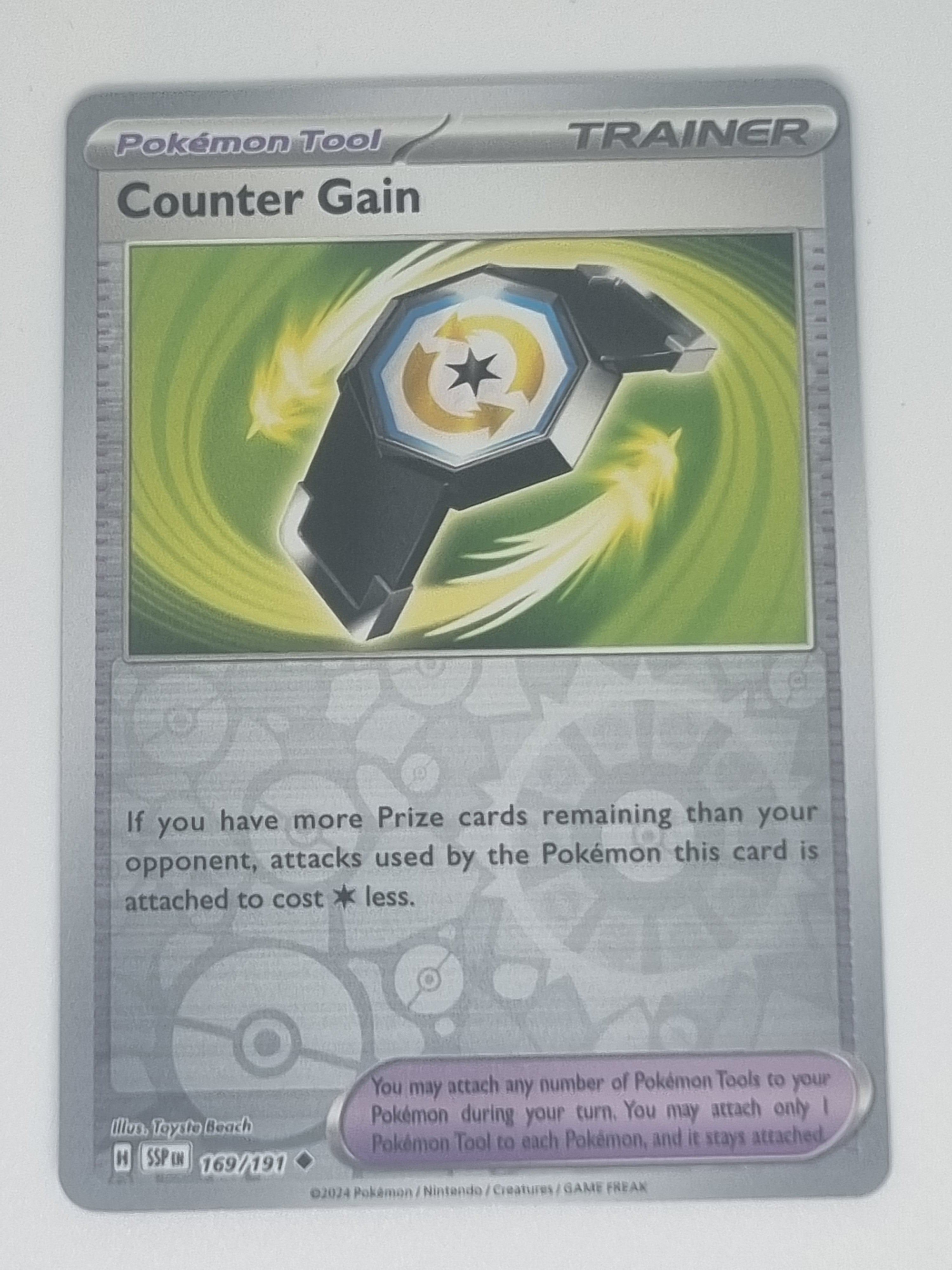 Pokemon TCG - Surging Sparks - #169/191 - Reverse Holo - Counter Gain - Uncommon